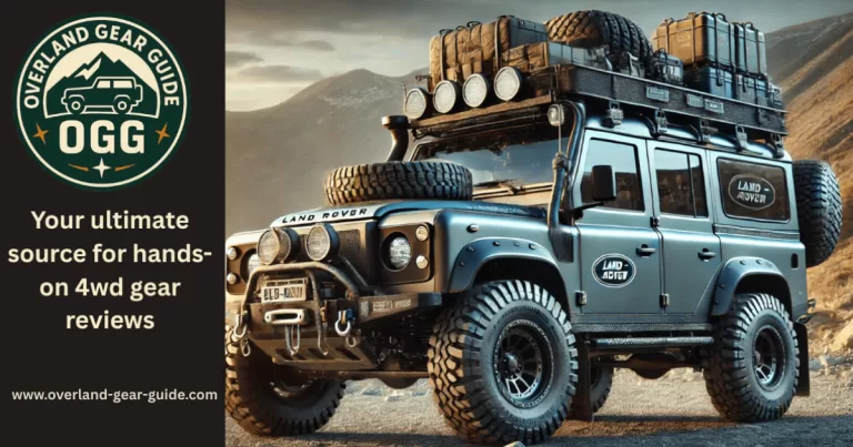Overland Gear Guide logo next to a custom-built Land Rover Defender 4x4, heavily loaded with expedition equipment, on a mountain trail. This image represents our source for hands-on overland gear reviews. contact page